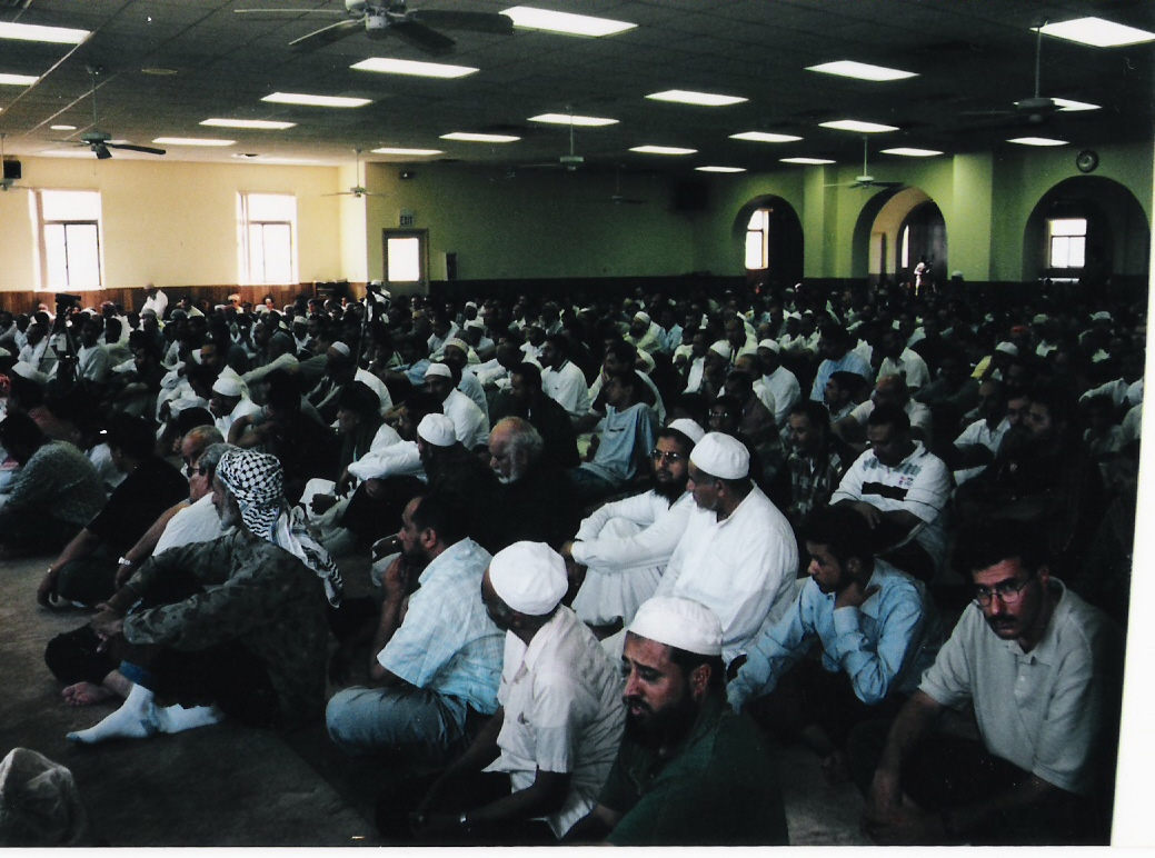 Worshipers inside the AMS in what is now the middle prayer area, showing the congregation before or during the final expansion
